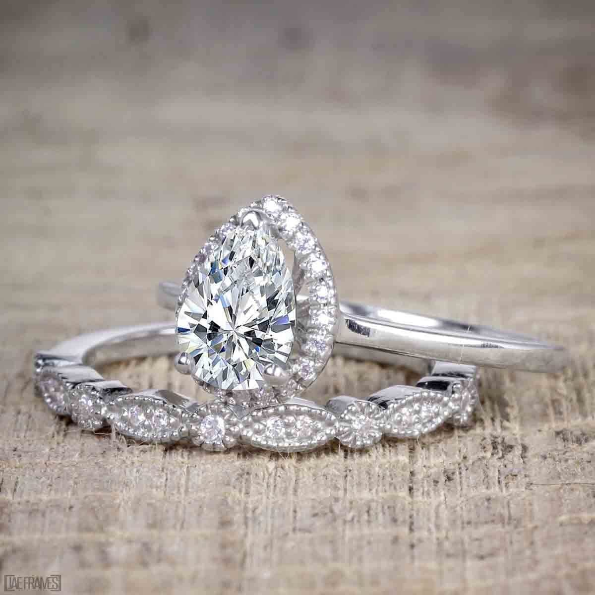 Pear Cut Moissanite and Diamond Halo Wedding Ring Set in White Gold Q9746